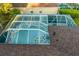 Enclosed pool and spa with tiled deck and screened enclosure at 16310 Ashington Park Dr, Tampa, FL 33647