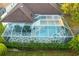 Enclosed pool and spa with tiled deck and screened enclosure at 16310 Ashington Park Dr, Tampa, FL 33647