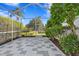 Spacious screened patio with checkered tile floor at 16310 Ashington Park Dr, Tampa, FL 33647