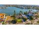 Aerial view showcasing home's location on the waterfront with a neighborhood view at 16323 Redington Dr, Redington Beach, FL 33708