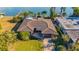 Single story home with tile roof, garage and waterfront views at 16323 Redington Dr, Redington Beach, FL 33708