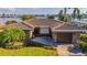 Single-story home with tile roof, large yard and water views at 16323 Redington Dr, Redington Beach, FL 33708