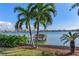 Waterfront view with private dock and lush landscaping at 16323 Redington Dr, Redington Beach, FL 33708