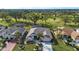 Bird's eye view of a home with a pool, and golf course in background at 324 Caloosa Palms Ct, Sun City Center, FL 33573