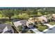 Aerial view of a neighborhood with houses near a golf course at 324 Caloosa Palms Ct, Sun City Center, FL 33573