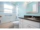 Updated bathroom featuring granite countertop and a walk-in shower at 324 Caloosa Palms Ct, Sun City Center, FL 33573