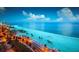 Scenic beachfront at night with palm trees and lights at 324 Caloosa Palms Ct, Sun City Center, FL 33573