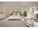 Primary bedroom with stylish furniture and decor at 324 Caloosa Palms Ct, Sun City Center, FL 33573