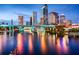 Tampa, Florida cityscape reflected in the water at dusk at 324 Caloosa Palms Ct, Sun City Center, FL 33573