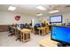 Computer lab with multiple workstations and instructor at 324 Caloosa Palms Ct, Sun City Center, FL 33573