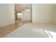 Bright and spacious entryway with hardwood floors and views of other rooms at 324 Caloosa Palms Ct, Sun City Center, FL 33573
