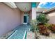 Front entry with teal accents and patterned flooring at 324 Caloosa Palms Ct, Sun City Center, FL 33573
