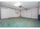Spacious garage with ample storage cabinets at 324 Caloosa Palms Ct, Sun City Center, FL 33573