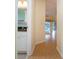 Light-filled hallway leading to bathroom and living area at 324 Caloosa Palms Ct, Sun City Center, FL 33573