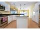 Bright kitchen with stainless steel appliances and an island at 324 Caloosa Palms Ct, Sun City Center, FL 33573