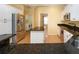Spacious kitchen with stainless steel appliances and island at 324 Caloosa Palms Ct, Sun City Center, FL 33573