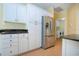 Kitchen boasts stainless steel appliances and ample cabinet space at 324 Caloosa Palms Ct, Sun City Center, FL 33573