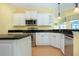 Modern kitchen with stainless steel appliances and granite countertops at 324 Caloosa Palms Ct, Sun City Center, FL 33573