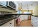 Well-equipped kitchen featuring stainless steel appliances and granite counters at 324 Caloosa Palms Ct, Sun City Center, FL 33573