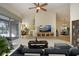 Spacious living room featuring stylish furniture and a flat-screen TV at 324 Caloosa Palms Ct, Sun City Center, FL 33573