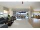 Living room with view of pool and patio furniture at 324 Caloosa Palms Ct, Sun City Center, FL 33573