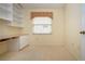 Bright office with built-in shelving and desk at 324 Caloosa Palms Ct, Sun City Center, FL 33573