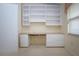 Bright office with built-in shelving and desk at 324 Caloosa Palms Ct, Sun City Center, FL 33573