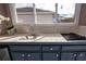 Stainless steel sink and grill in outdoor kitchen at 324 Caloosa Palms Ct, Sun City Center, FL 33573