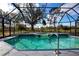 Inviting screened pool and spa with tranquil golf course views at 324 Caloosa Palms Ct, Sun City Center, FL 33573