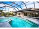 Inviting pool and spa with screened enclosure, perfect for relaxation at 324 Caloosa Palms Ct, Sun City Center, FL 33573