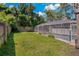 Spacious backyard with grassy area at 394 Ulelah Ave, Palm Harbor, FL 34683
