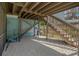 Unfinished basement with wooden stairs and gravel floor at 394 Ulelah Ave, Palm Harbor, FL 34683