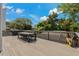 Outdoor deck with a table, chairs, and grill at 394 Ulelah Ave, Palm Harbor, FL 34683