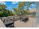 Spacious deck with seating area and grill, overlooking the backyard at 394 Ulelah Ave, Palm Harbor, FL 34683