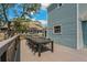 Deck with table and chairs, offering scenic backyard views at 394 Ulelah Ave, Palm Harbor, FL 34683