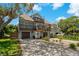 Two-story home with balconies at 394 Ulelah Ave, Palm Harbor, FL 34683
