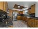 Spacious kitchen with stainless steel appliances and granite countertops at 394 Ulelah Ave, Palm Harbor, FL 34683