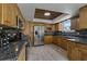 Updated kitchen with granite countertops and wooden cabinetry at 394 Ulelah Ave, Palm Harbor, FL 34683