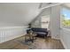 Comfortable loft sitting area with sofa and wood flooring at 394 Ulelah Ave, Palm Harbor, FL 34683