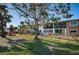 Back view of condo building showcasing landscaping and individual unit entrances at 4580 Overlook Ne Dr # 297, St Petersburg, FL 33703