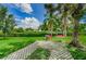 Landscaped lawn area with seating and a grassy area at 4580 Overlook Ne Dr # 297, St Petersburg, FL 33703