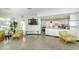 Community room with comfortable seating, a TV, and a kitchenette at 4580 Overlook Ne Dr # 297, St Petersburg, FL 33703