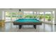 Community game room featuring a billiard table and access to outdoor patio at 4580 Overlook Ne Dr # 297, St Petersburg, FL 33703