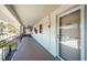 Condominium hallway with white walls and balcony at 4580 Overlook Ne Dr # 297, St Petersburg, FL 33703