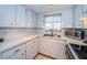 White kitchen with ample counter space and cabinets at 4580 Overlook Ne Dr # 297, St Petersburg, FL 33703