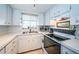 White kitchen with appliances and ample counter space at 4580 Overlook Ne Dr # 297, St Petersburg, FL 33703