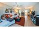 Open living space showcasing a comfortable sectional sofa and views into the kitchen at 4580 Overlook Ne Dr # 297, St Petersburg, FL 33703