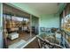 Relaxing screened balcony with outdoor furniture and partial water view at 4580 Overlook Ne Dr # 297, St Petersburg, FL 33703