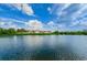Tranquil waterfront view of a residential building at 4580 Overlook Ne Dr # 297, St Petersburg, FL 33703