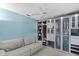 Bright bedroom with large closet and light gray sofa at 12038 Steppingstone Blvd, Tampa, FL 33635